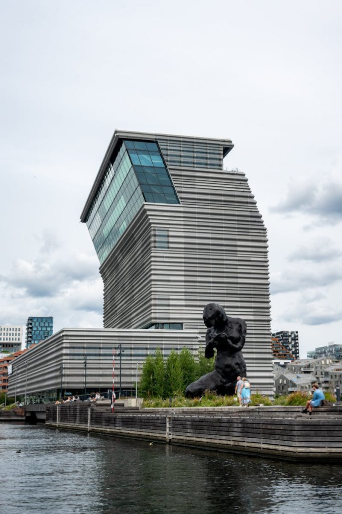 Discover the distinctive architecture of Oslo's MUNCH Museum by the waterfront.